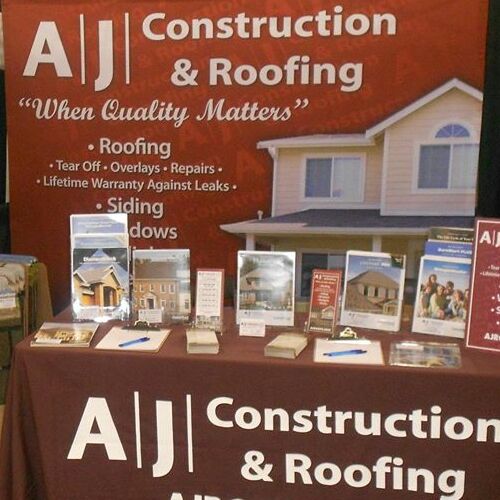 An AJ Construction & Roofing Booth.